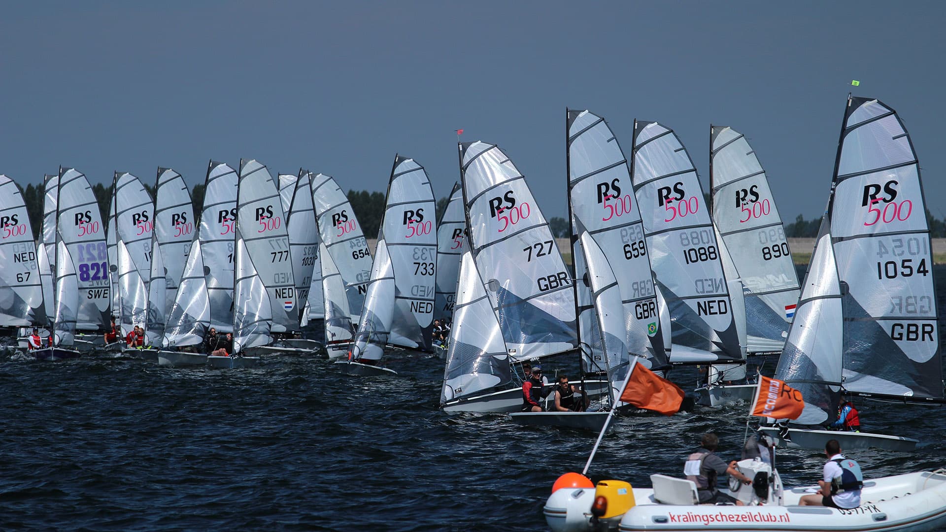 RS500 fleet lined up along the start line before a race